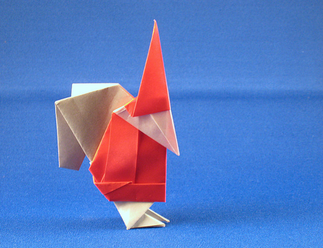 Origami Santa Claus by Kunihiko Kasahara. Folded from 2 squares of origami paper by Gilad Aharoni on giladorigami.com