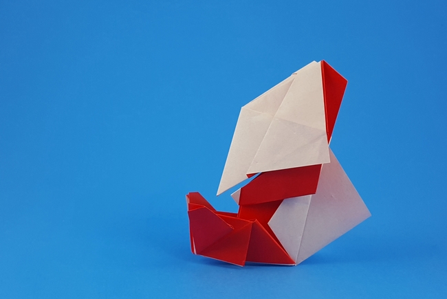 Origami Santa Claus by Katsushi Nosho. Folded from 2 squares of origami paper by Gilad Aharoni on giladorigami.com