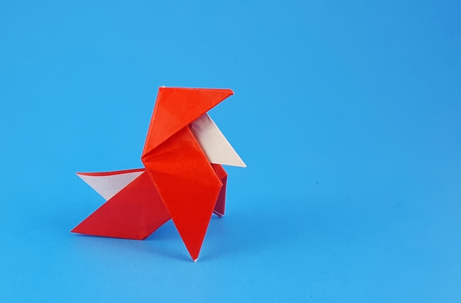Origami Santa pajarita by Jacques Justin. Folded from a square of origami paper by Gilad Aharoni on giladorigami.com