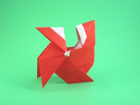 Origami Santa Claus on pajarita by Luis Fernandez Perez. Folded by Gilad Aharoni on giladorigami.com