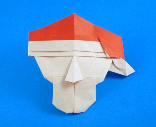 Origami Santa by David Petty. Folded from a square of origami paper by Gilad Aharoni on giladorigami.com