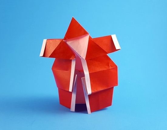 Origami Santa Claus - Good or bad by Bernie Peyton. Folded from a square of origami paper by Gilad Aharoni on giladorigami.com