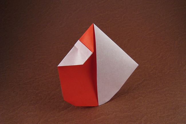 Origami Santa - rocking by David Petty. Folded from a square of origami paper by Gilad Aharoni on giladorigami.com