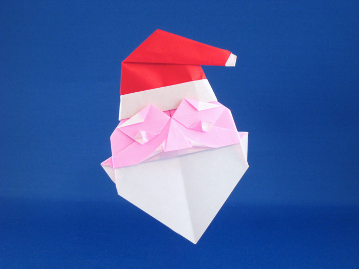 Origami Santa Claus by Mieko Seta. Folded from 2 squares of origami paper by Gilad Aharoni on giladorigami.com