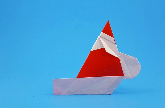 Origami Santa on sleigh by Wayne Brown. Folded from a square of origami paper by Gilad Aharoni on giladorigami.com
