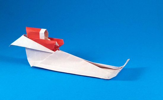 Origami Santa Claus and Sleigh by Ted Norminton. Folded from a rectangle of origami paper by Gilad Aharoni on giladorigami.com