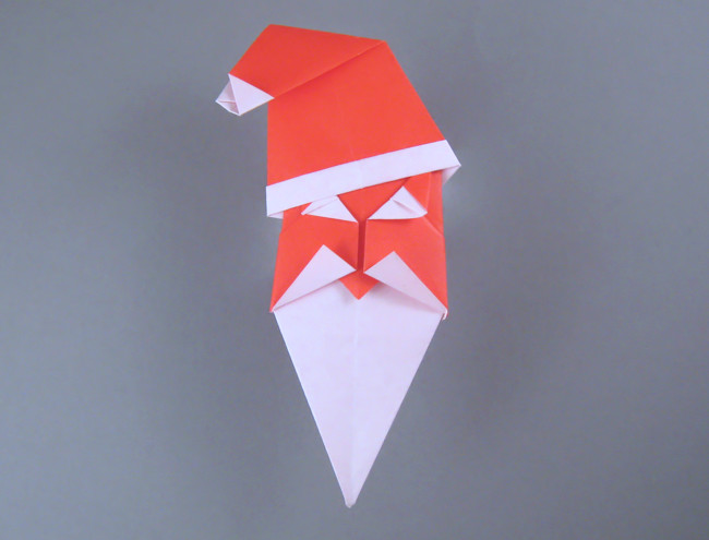 Origami Santa Claus head by John Smith. Folded from 2 squares of origami paper by Gilad Aharoni on giladorigami.com