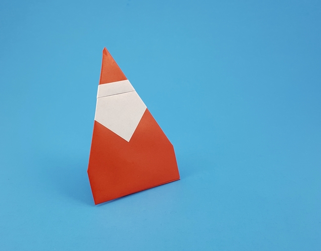 Origami Santa - standing by Francesco Mancini. Folded from a square of origami paper by Gilad Aharoni on giladorigami.com
