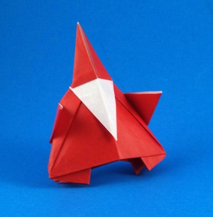 Origami Santa Claus by Tsuda Yoshio. Folded from a square of origami paper. Original design requires cuts, this is my no-cut version by Gilad Aharoni on giladorigami.com