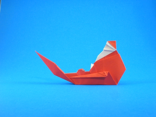 Origami Santa Claus on a sleigh by Martin Wall. Folded from a square of origami paper by Gilad Aharoni on giladorigami.com