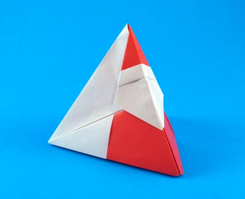 Origami Santa Claus tetrahedron box by Makoto Yamaguchi. Folded from 2 squares of origami paper by Gilad Aharoni on giladorigami.com