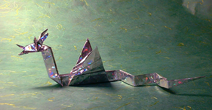 Origami Sea serpent by John Montroll. Folded from a square of holographic gift-wrap by Gilad Aharoni on giladorigami.com