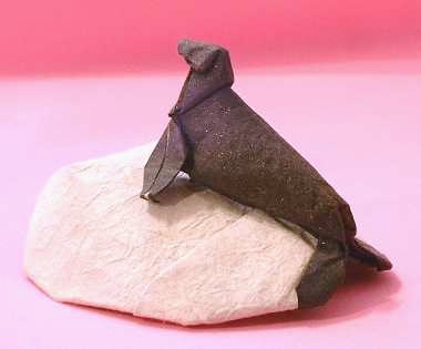 Origami Seal on a rock by Martin Wall. Folded by Gilad Aharoni on giladorigami.com