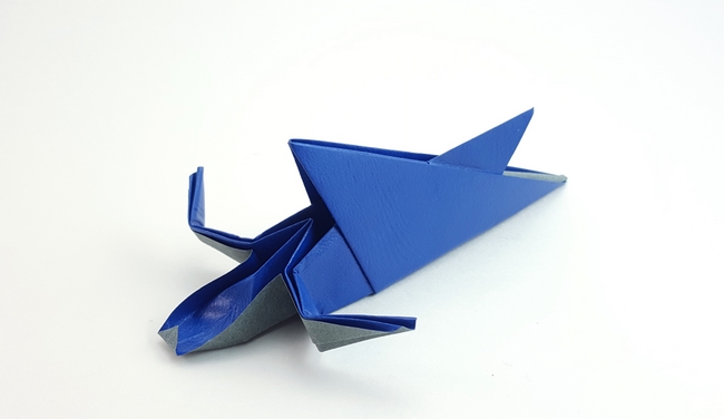 Origami Shark eating person - Time for lunch by Nick Robinson. Folded from a square of textured origami paper by Gilad Aharoni on giladorigami.com