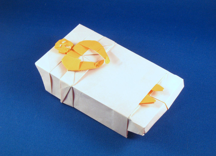 Origami Man in bed - sick by Fernando Gilgado Gomez. Folded from a square of origami paper by Gilad Aharoni on giladorigami.com
