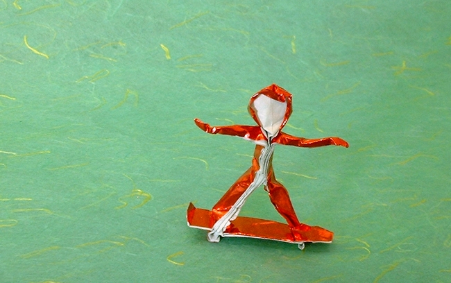 Origami Skateboard rider by Eran Leiserowitz. Folded from a square of Japanese foil by Gilad Aharoni on giladorigami.com