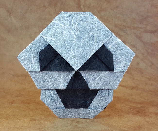 Origami Skull by Matthew Gardiner. Folded from a square of Duo Thai paper by Gilad Aharoni on giladorigami.com