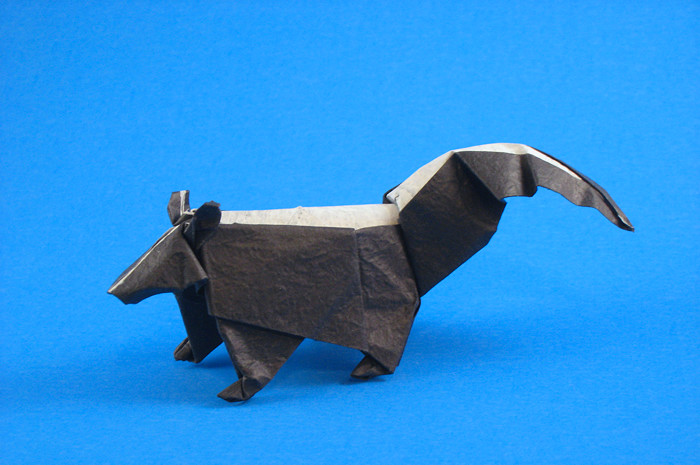 Origami Skunk by John Montroll. Folded from a square of Vietnamese wrapping-paper by Gilad Aharoni on giladorigami.com
