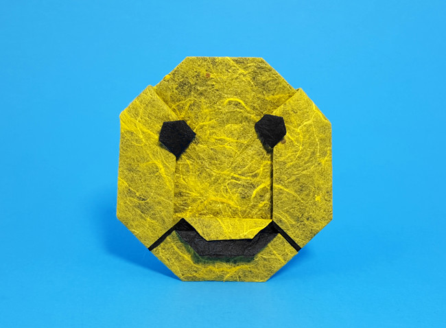 Origami Smiley face by Marc Kirschenbaum. Folded from a square of Duo Thai origami paper by Gilad Aharoni on giladorigami.com