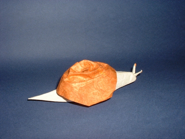Origami Snail by Akira Yoshizawa. Folded from a square of rice paper by Gilad Aharoni on giladorigami.com
