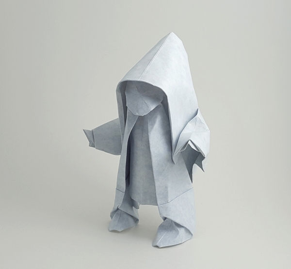 Origami Snow Child by Akira Yoshizawa. Wet folded from a square of Astroparche crepe embossed cardstock by Gilad Aharoni on giladorigami.com