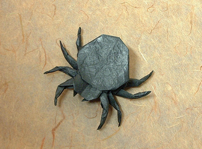 Origami Spider by John Montroll. Folded from a square of Vietnamese wrapping-paper by Gilad Aharoni on giladorigami.com