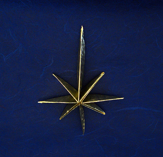 Origami Star of Bethlehem by John Montroll. Folded from a square of Japanese foil by Gilad Aharoni on giladorigami.com