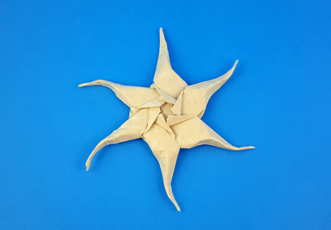 Origami Star variations by Ilan Garibi. Folded from a hexagon of parchment paper by Gilad Aharoni on giladorigami.com