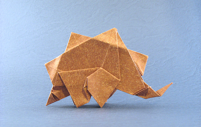 Origami Stegosaurus by Ryan MacDonell (Cupcake). Folded from a square of Speckle-design paper by Gilad Aharoni on giladorigami.com