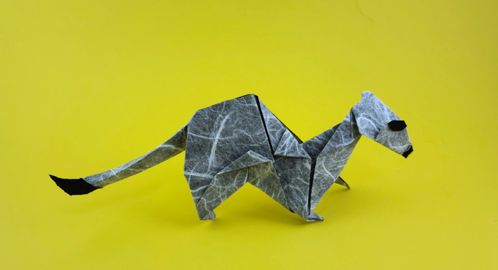 Origami Stoat by Sebastien Limet (Sebl). Folded from a triangle of Duo Thai origami paper by Gilad Aharoni on giladorigami.com