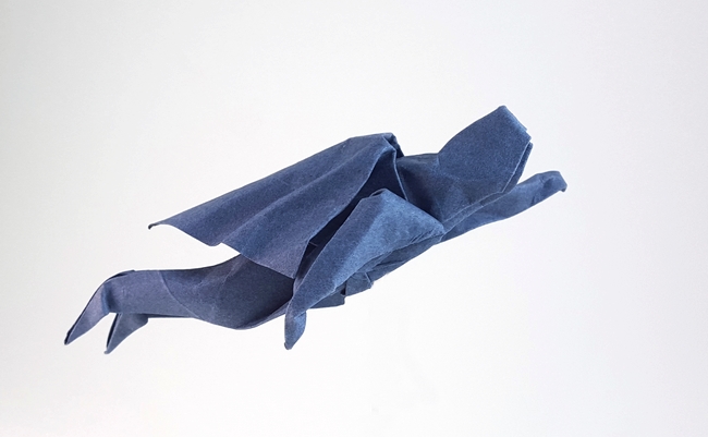Origami Superman flying by John Montroll. Folded from a square of Canson art paper by Gilad Aharoni on giladorigami.com