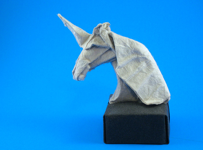 Origami Unicorn bust by Eileen Tan. Head wet-folded from a square of heavy art paper back-coated with rice paper, base folded from a square of art paper by Gilad Aharoni on giladorigami.com