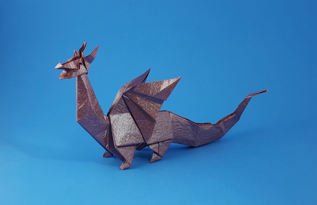 Origami Western dragon by John Montroll. Folded from a square of Vietnamese wrapping paper by Gilad Aharoni on giladorigami.com
