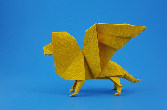 Origami Winged lion by John Montroll. Folded from a square of Vietnamese wrapping paper by Gilad Aharoni on giladorigami.com