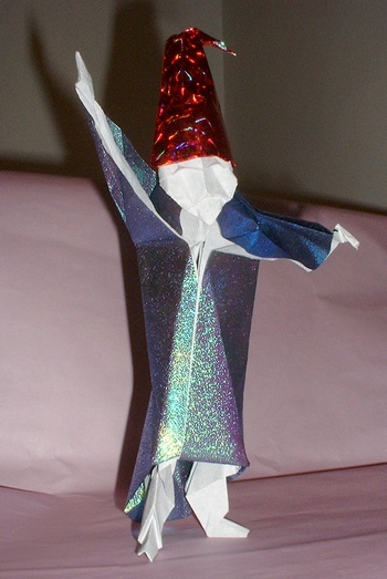 Origami Wise man 1 by David Brill. Folded from a square of holographic gift-wrap, and the hat from another small holographic square by Gilad Aharoni on giladorigami.com
